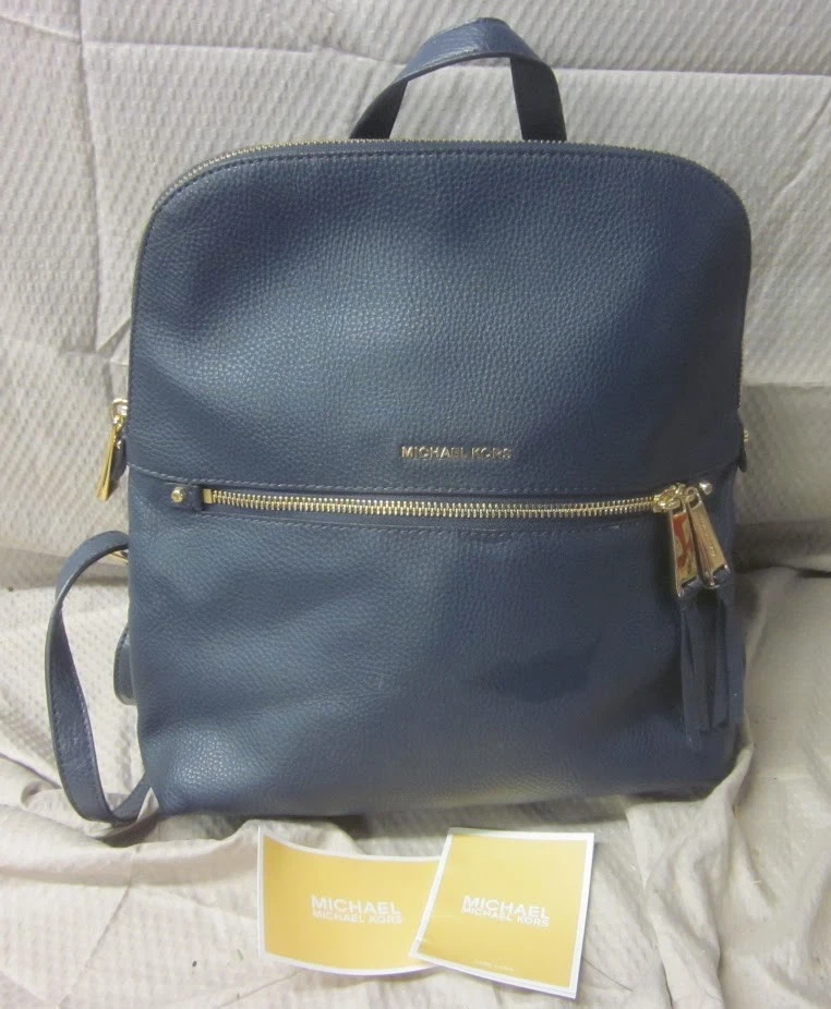 Mochila Michael Kors Rhea delgada de cuero granulado azul borde dorado precio de venta sugerido por el fabricante 378 USD - COMO NUEVA Foto 1 de 4