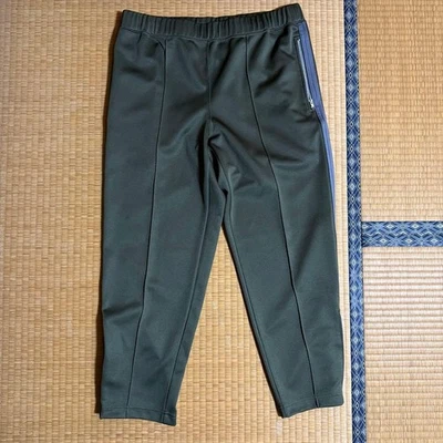 CAMISA COMME des GARCONS Pantalones de Pista Oliva XL Calce Ajustado Informal Frente Plano Foto 1 de 4