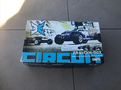 1/10 Circuit 2WD Stadium Truck Brushed RTR, Red/Black TESTED - Image 1 of 4