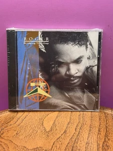 Roger - Bridging the Gap - CD - NEW Sealed - *BUY 2 GET 1 FREE* - Picture 1 of 2
