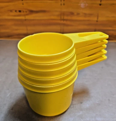 Vintage Five Piece Yellow Tupperware Measuring Cups - Image 1 of 3