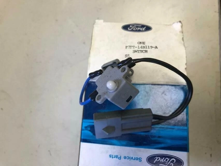 Interruptor de liberación de correa de hombro asiento Ford Escort 1987 1988 nuevo de lote E7FZ-14B119-A Foto 1 de 1