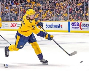 Filip Forsberg Nashville Predators Unsigned Gold Jersey Shooting Photo - Picture 1 of 1
