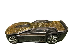 Hot Wheels Solar Reflex placcato oro e nero motivo geometrico auto esagonale - Foto 1 di 6