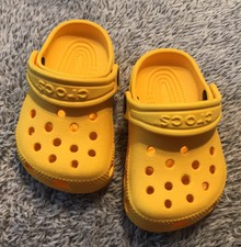yellow infant crocs