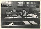1953 Press Photo Employees monitor machinery parts at agricultural company in IL