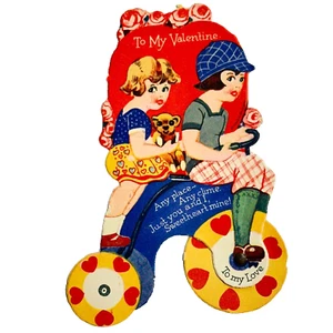 Vintage mechanisches Valentine junge Mädchen auf Dreirad Vorderrad dreht sich - Bild 1 von 3