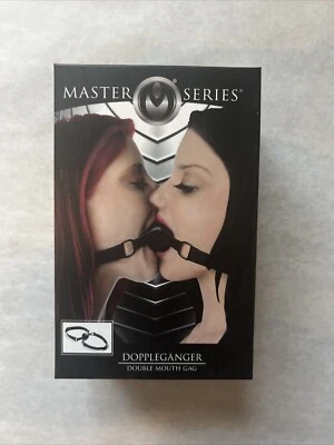 Mordaza bucal de silicona para adultos de doble bola negra con correas ajustables. Foto 1 de 4