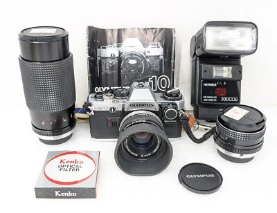 Macchina fotografica Olympus OM10 con ottiche aggiuntive flash e manual adapter - Immagine 1 di 4