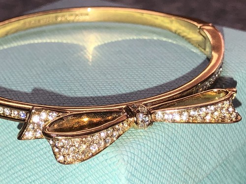 Bracciale Kate Spade Love Notes tono oro giallo pavè cristallo fiocco cerniera