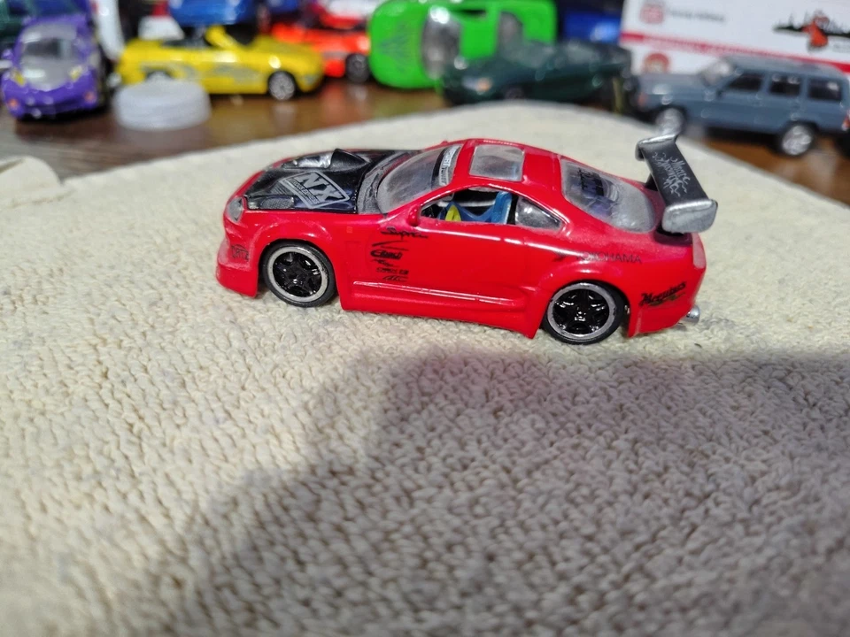 Muscle Machines Import Tuner Red 97 Toyota Supra T02-36 1:64 Die Cast Car - Image 1 of 4