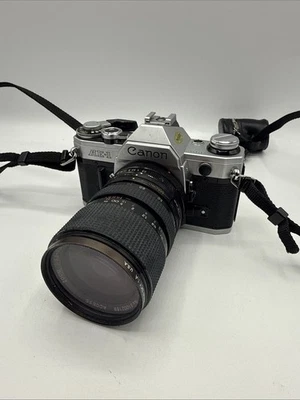 Cámara fotográfica Canon AE-1 35 mm SLR PROBADA con lente 35:70 sin probar Foto 1 de 4