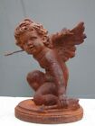 cupidon , statue d un angelot en fonte patiné rouillé ...