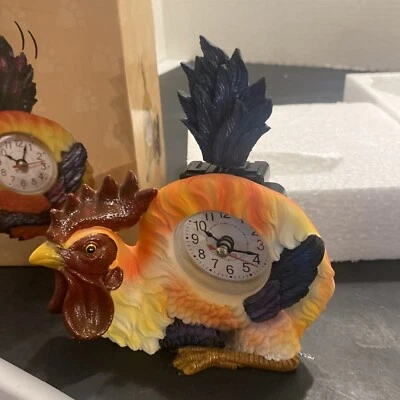 A.I.E. ART INTERNATIONAL ENTERPRISES Rooster Wagging Tails Clock - 6"W x 5"H. LH
