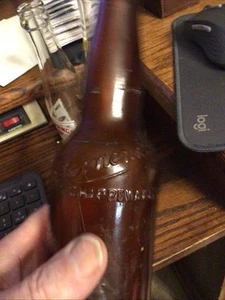 LEINENKUGELS BEER BOTTLE AMBER EMBOSSED 1909 12 Oz CHIPPEWA FALLS . WIS WI. - Picture 1 of 9
