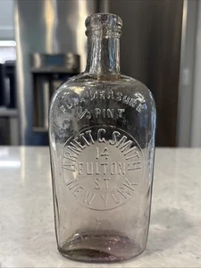Arnett G Smith 14 Fulton St NY 1/2 Pint Clear Strap Flask Whittle - Picture 1 of 24