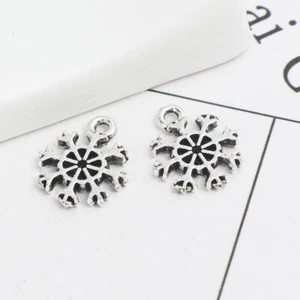 BULK BUY 20 Small Cute Christmas Snowflake Charm Pendants 13 x 11mm - Picture 1 of 2
