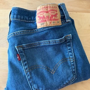 Jeans Levi's 505 uomo W33 L34 regular fit gamba dritta lavaggio scuro pantaloni denim - Foto 1 di 12