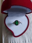 Oval Emerald Halo Ring with Accents in Size 7
