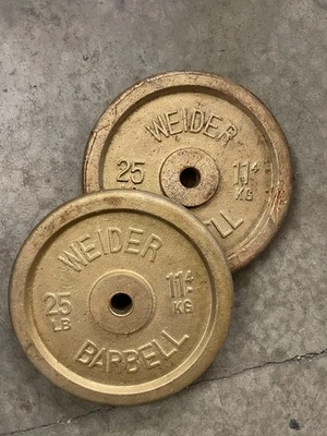 "Par de placas de peso Weider Barbell de 25 libras oro estándar tamaño 1"" agujero 50 en total" Foto 1 de 3