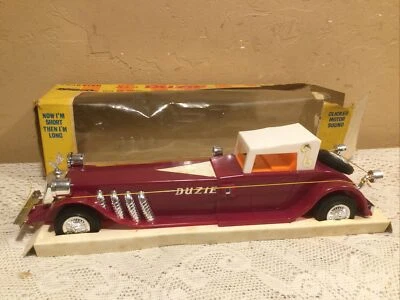 Coche telescópico de juguete de plástico Cragstan 4035-1 "It's A Duzie" vintage años 70 Foto 1 de 4
