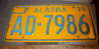 Alaska License Plate 1975 issue, AD 7986, gold style, good condition, embossed