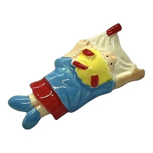 Vintage 1980s Cute PLASTIC Blue Red SUNBATHING Person Figure BROOCH - Picture 1 of 3