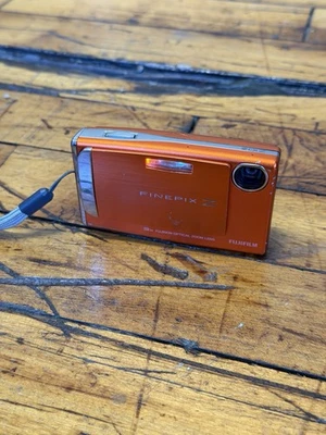 Cámara digital Fujifilm FinePix Z10fd 7,2 MP 3x zoom naranja buena para piezas Foto 1 de 4
