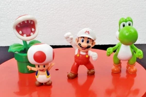 Lote de 4 figuras Jakks Super Mario ~ planta piraña ~ sapo ~ flor de fuego Mario ~ Yoshi - Imagen 1 de 16