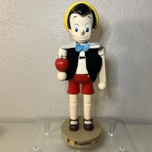 Walt Disneys Pinocchio Kurt Adler Deko Urlaub Nussknacker hält Apfel - Bild 1 von 11