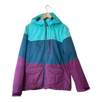 Chaqueta de esquí Oakley para mujer Bravo aislada grande retro bloques de color azul nieve púrpura Foto 1 de 4