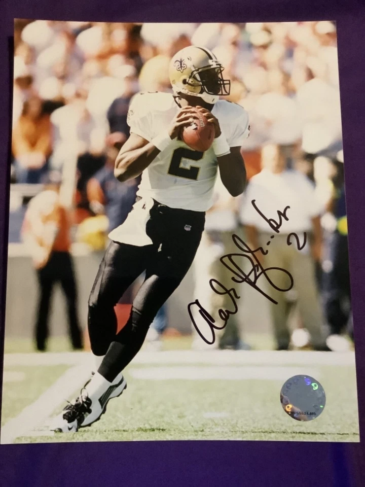 FOTO FIRMADA POR AARON BROOKS 8X10 NEW ORLEANS SAINTS UVA FÚTBOL CERTIFICADO DE AUTENTICIDAD AUTOMÁTICO Foto 1 de 1
