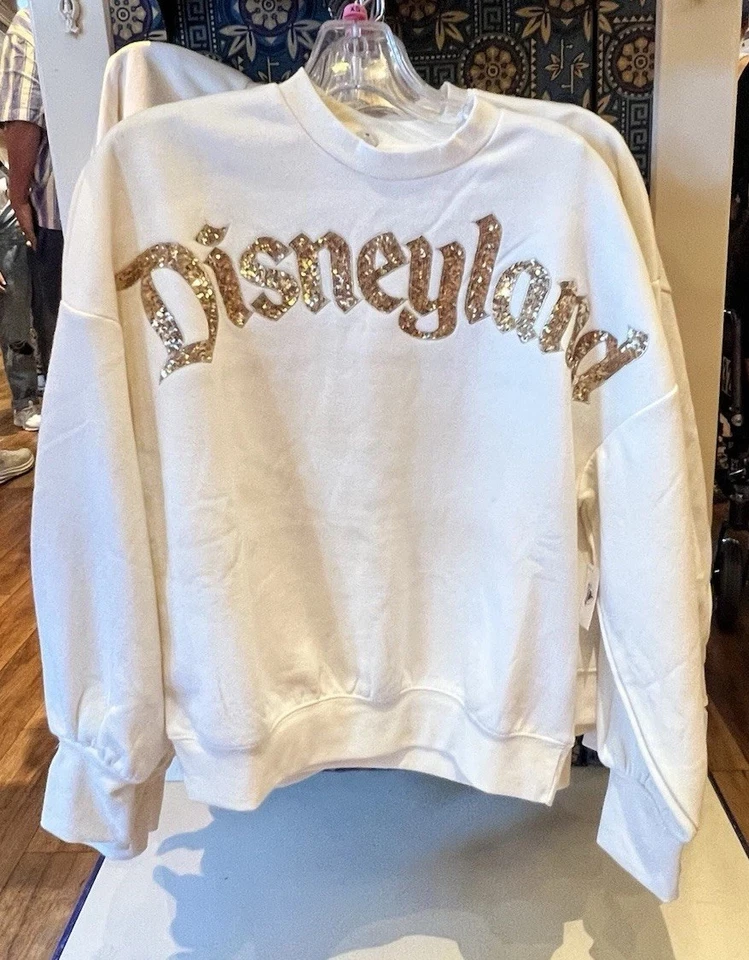 Sudadera Pullover Grande Disneyland 2025 Crema con Lentejuelas Doradas Foto 1 de 1