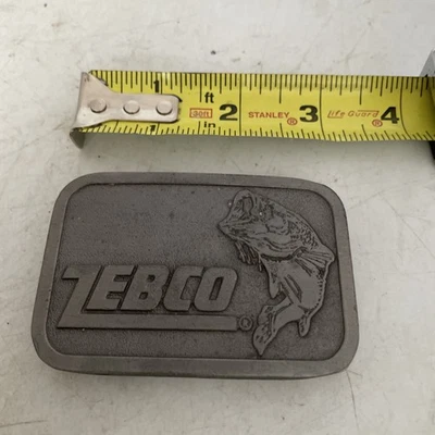 "Hebilla de cinturón Zebco, de Hit Line EE. UU. Vintage 3""" Foto 1 de 2