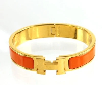 Pulsera Hermes NARANJA FRUTA Clic H chapada en oro herrajes PM Foto 1 de 4