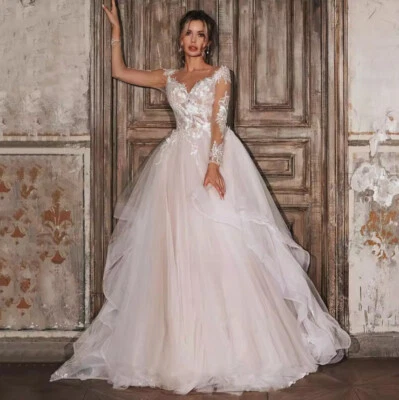 Vestido de novia con volantes rosa cepillo manga larga transparente apliques cuello redondo Foto 1 de 4