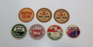 7 zufällige Milchkappen - Bild 1 von 2