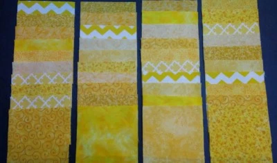 40 yellow 4" x 4" fabric squares 4 squares from 10 different prints - Image 1 of 2