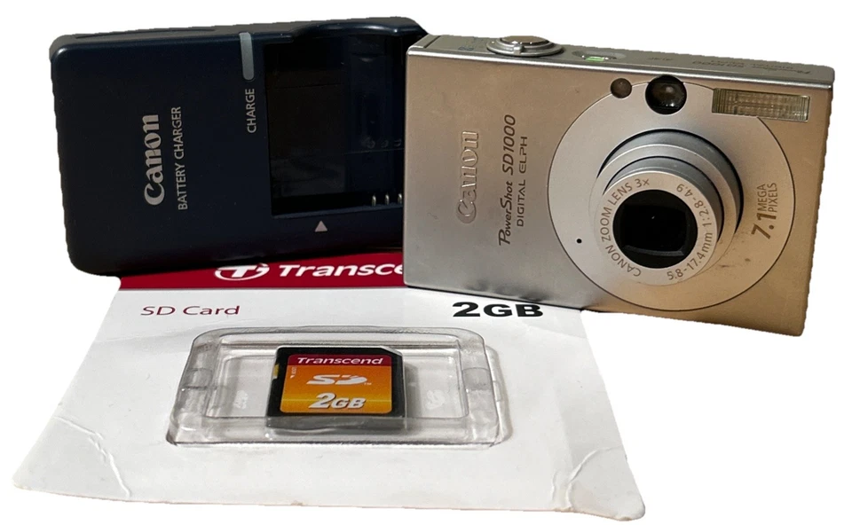 Cámara digital Canon PowerShot ELPH SD1000-PLATA con nueva tarjeta SD y cargador Foto 1 de 4