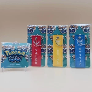 Pokémon GO 4-teiliges exklusives Lot - Tapferkeit, Instinkt, Mystische Schlüsselanhänger, GO Patch! - Bild 1 von 6