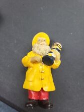 Santa in Yellow Raincoat with Lighthouse in Hand Christmas Ornament