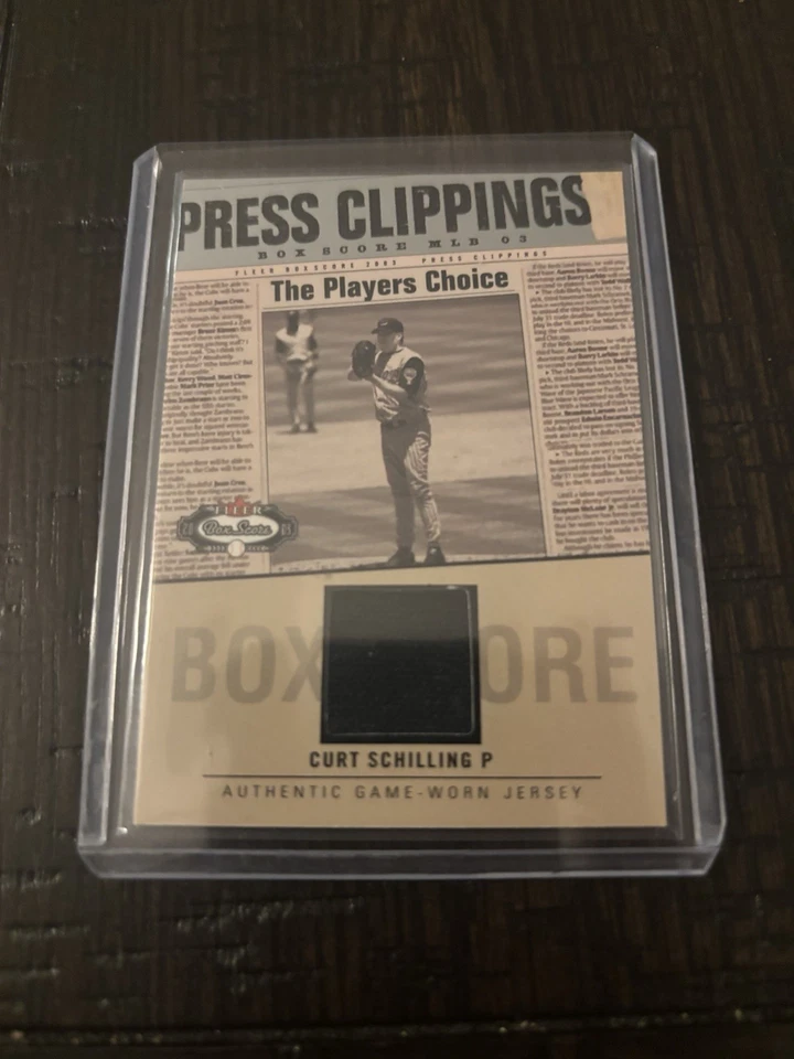 CURT SCHILLING 2003 FLEER BOX SCORE PRESS CLIPPINGS GAME USED WORN JERSEY AX6713 - Image 1 of 2