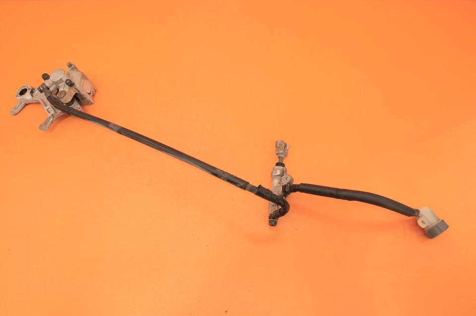 97-99 CR250R CR250 1997 OEM pinza de freno trasera soporte cilindro maestro manguera Foto 1 de 4