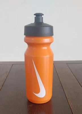 NIKE Squeeze Water Bottle 22 Oz Orange White Swoosh Black Twist Off Lid Pull Top - Image 1 of 4