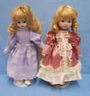 TWO PORCELAIN DOLLSBoth have BLONDE RINGLET HAIR BLUE EYES and STAND