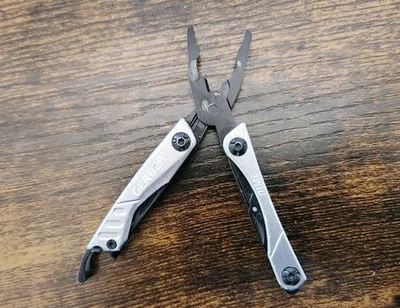 Silver Gerber Dime Assorted Colors 9 Functions - Scissors Pliers Knife - 557 - Image 1 of 4