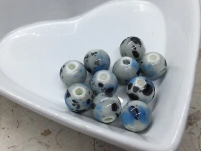 Pack of 10 porcelain ceramic beads, 10mm grey, blue, black splash marble design - Image 1 of 3