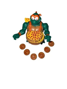 TMNT Pizza Tossin’ Mike Teenage Mutant Ninja con accesorios, con 6 discos de pizza - Imagen 1 de 7