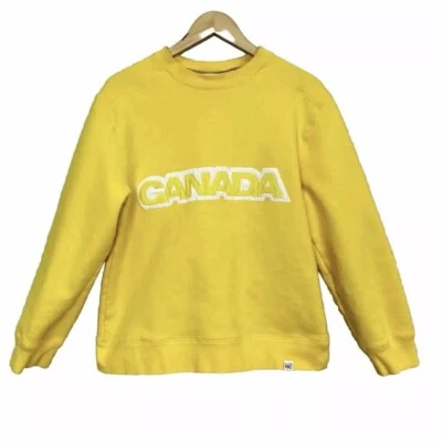 Hudson Bay Company HBC Canadá Juegos Olímpicos de Invierno Sudadera Amarilla Hombre’s Pequeña Foto 1 de 4