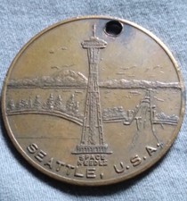 Vintage 1962 World's Fair Seattle Space Needle Token Pendant.